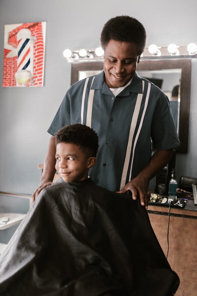 man in barbers chair getting haircut